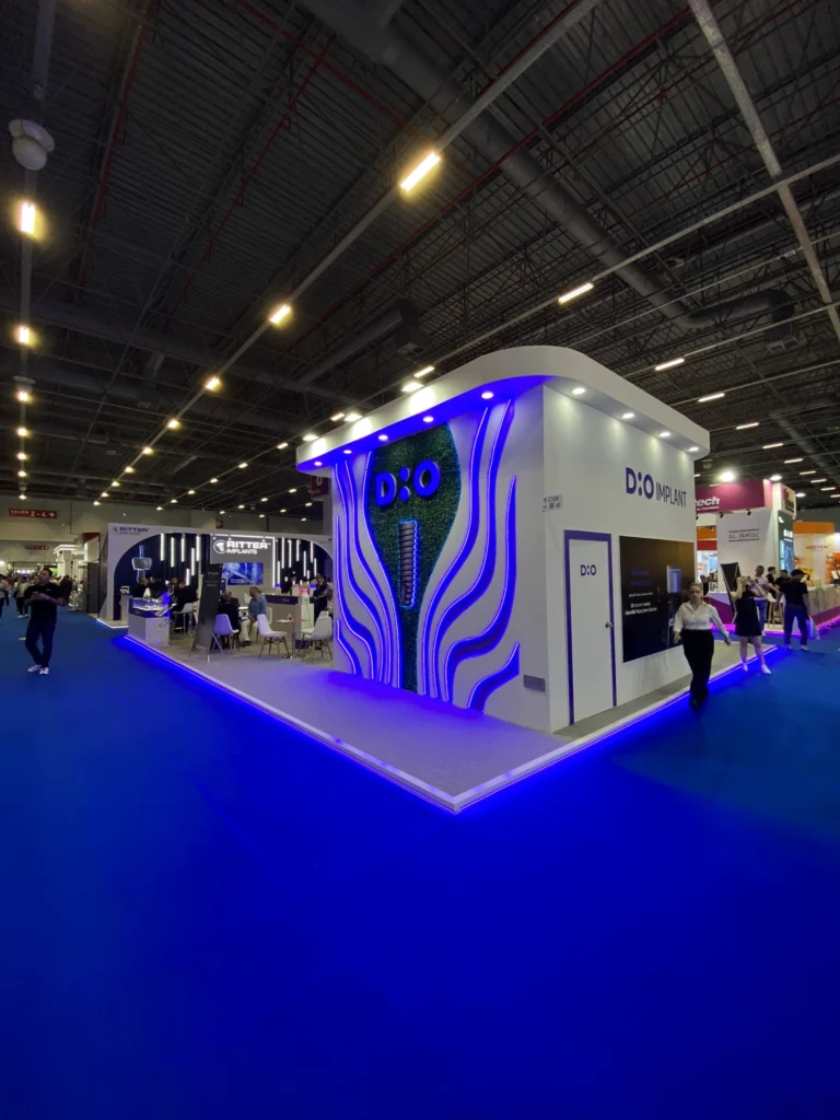 DIO Implant IDEX 2025: Rear perspective with illuminated CNC facade